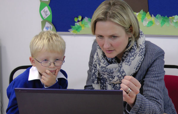 Pupil and teacher using the infant language screener